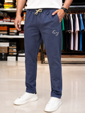 A-X EMBROIDERED CIRCULAR LOGO SLIM-FIT TRACK PANTS