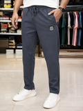 A-X EMBROIDERED BADGE SLIM-FIT TRACK PANTS