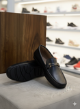 PRADA Men’s Executive Black Leather with Signature Gold-Tone Accents Loafers