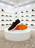 HERMS SUEDE SLIP-ONS WITH VIBRANT ORANGE SOLE LOAFERS